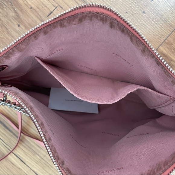 Gently used blush pink leather Coach crossbody bag with silver chain. - Picture 3 of 5